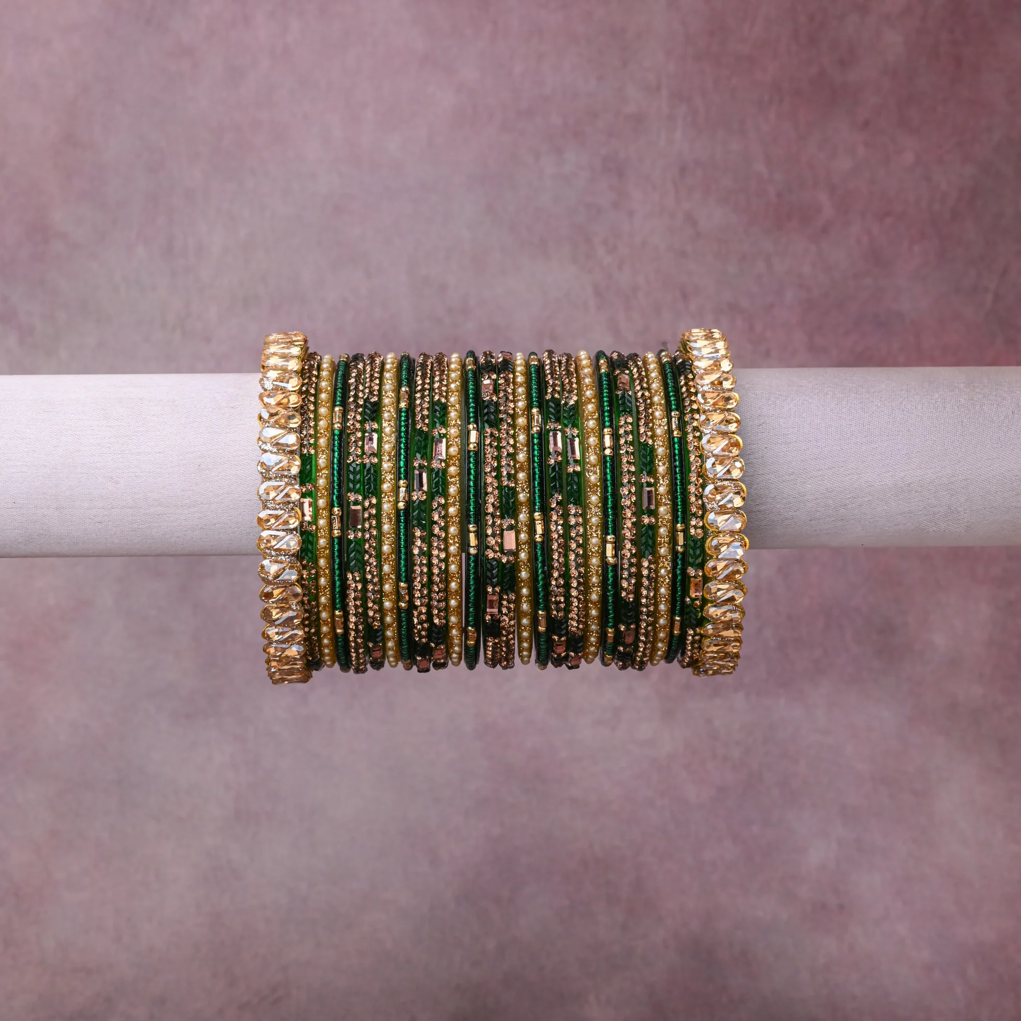 A grounding Emerald Green forms the heart of the set, while touches of Gold, Cream, Clear add charm.

A thoughtful composition of Glass, Gold-toned Metal, Simulated Pearls, Rhinestones, designed to feel complete without being heavy.
Each element layers seamlessly, creating a look that is refined, wearable and quietly striking.